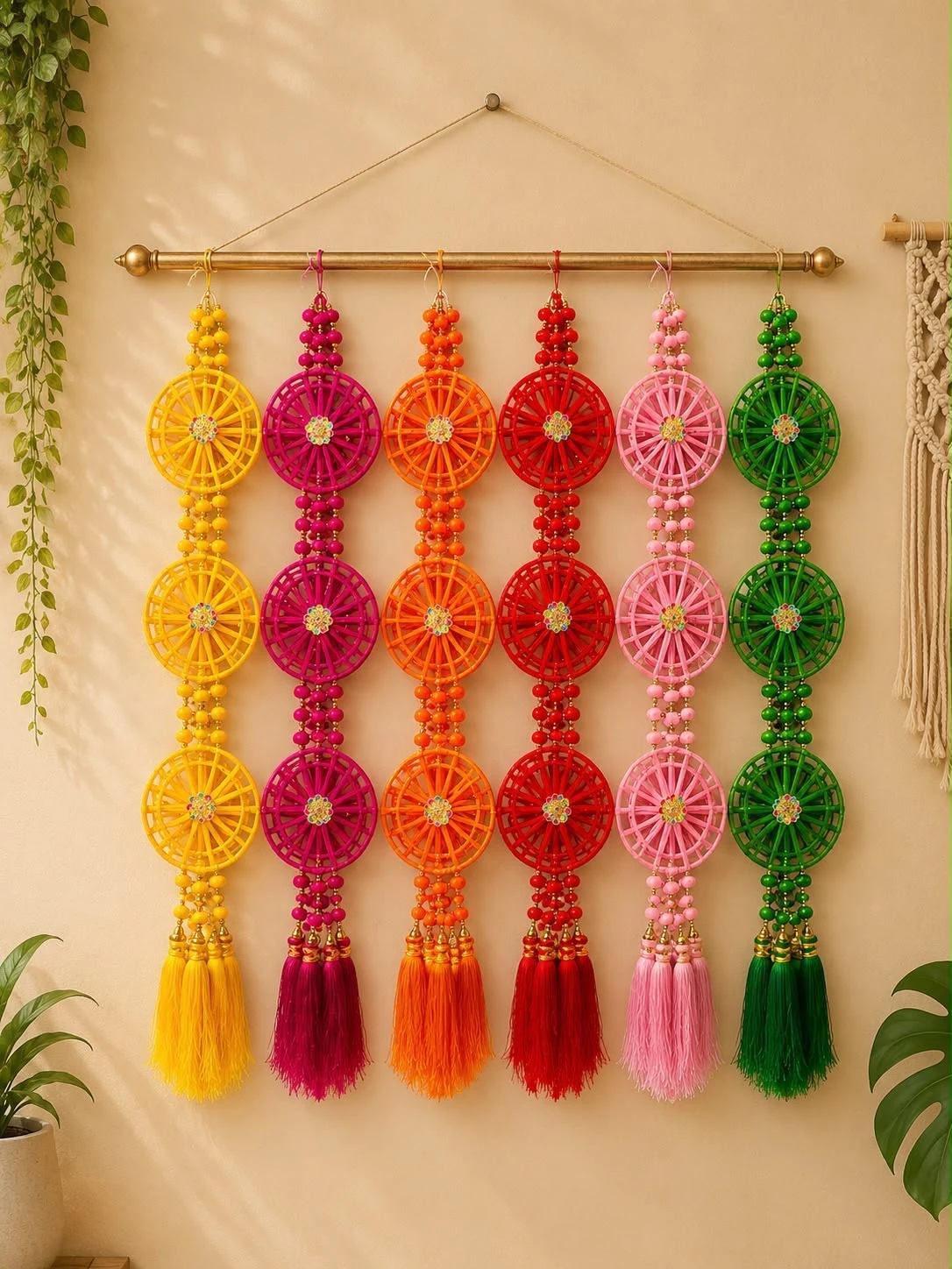 Multicolour woven wheel Diwali toran with beaded strands and tassels in yellow, magenta, orange, red, pink and green